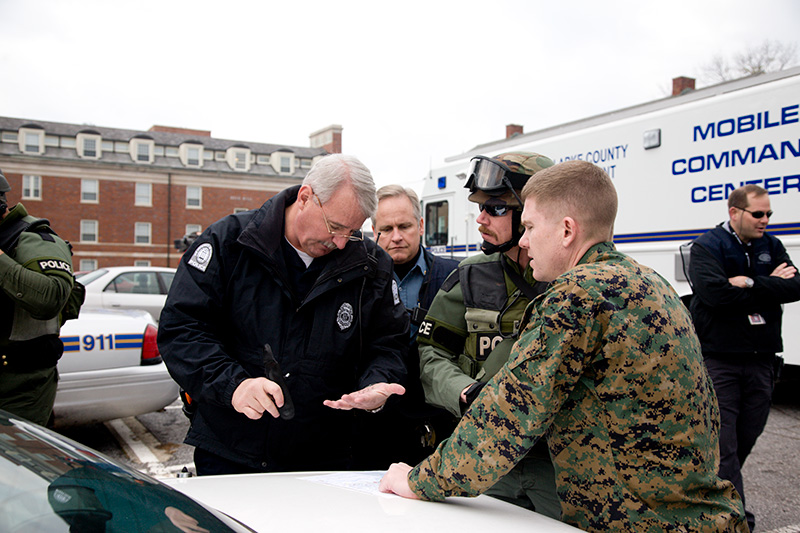 Police talking during an emergency response training drill.